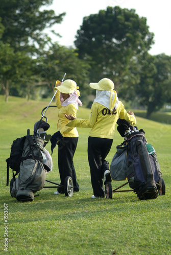 two caddies at a golf course
