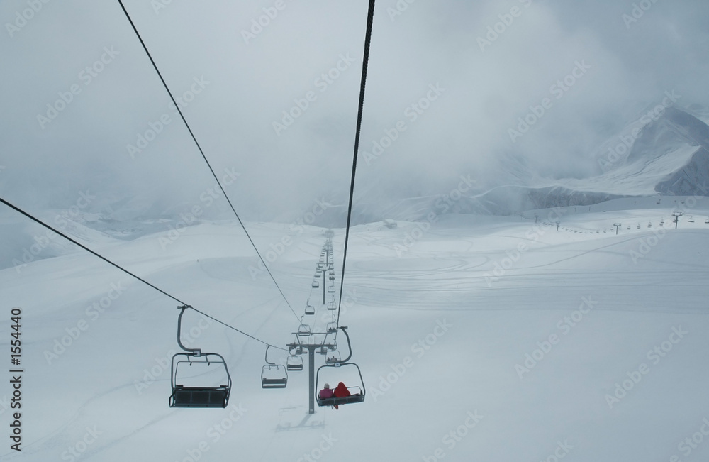 cables of skilift during blizzard