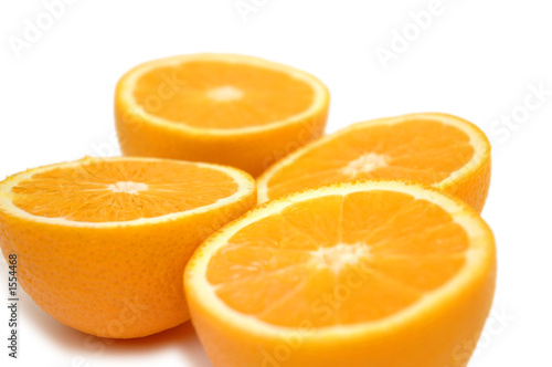 half-cut oranges isolated on white - shallow dof