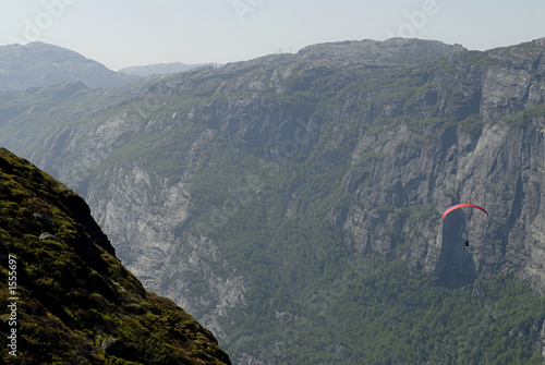 paragliding over mountains photo