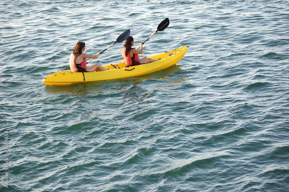 two woman kayak