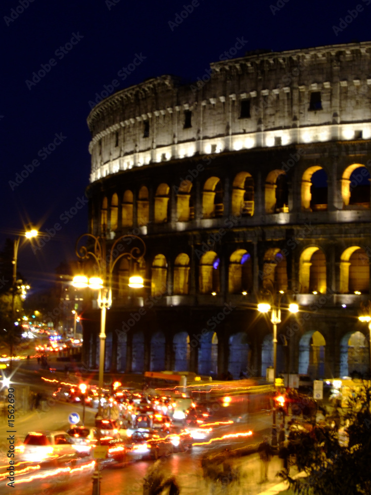 blurred night traffic in rome