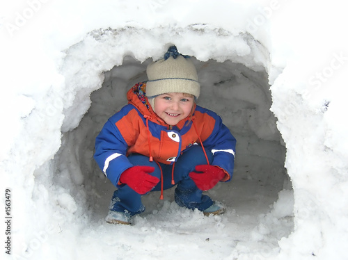 little girl playing in the snow