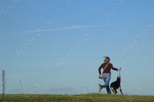 girl running with dog © jeffrey van daele