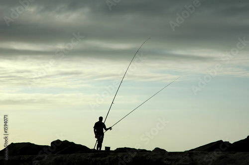 portugal, ericeira: fishing at dusk