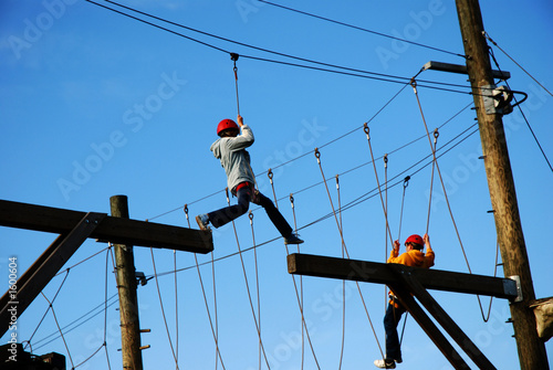 boy making a risky jump at an amusement park