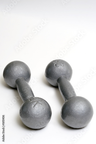 two weights laying on a white background