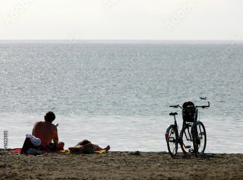 cyclists on beach