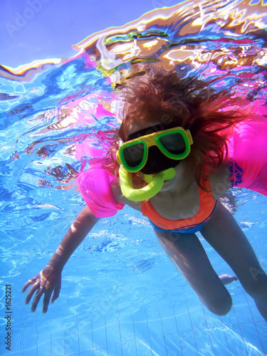 girl swimming underwater