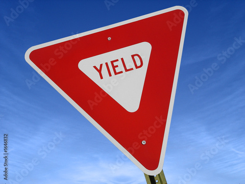 yield sign against blue sky