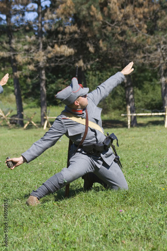 soldier launching a grenade