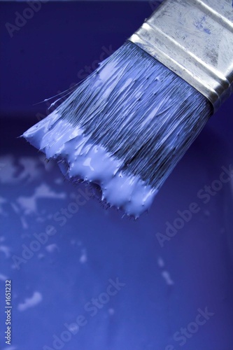blue paint on paintbrush