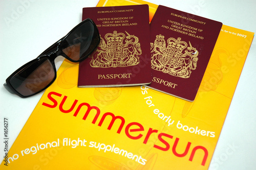 holiday brochure,passports and sun glasses