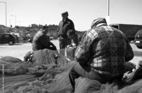 fishermen preparing nets