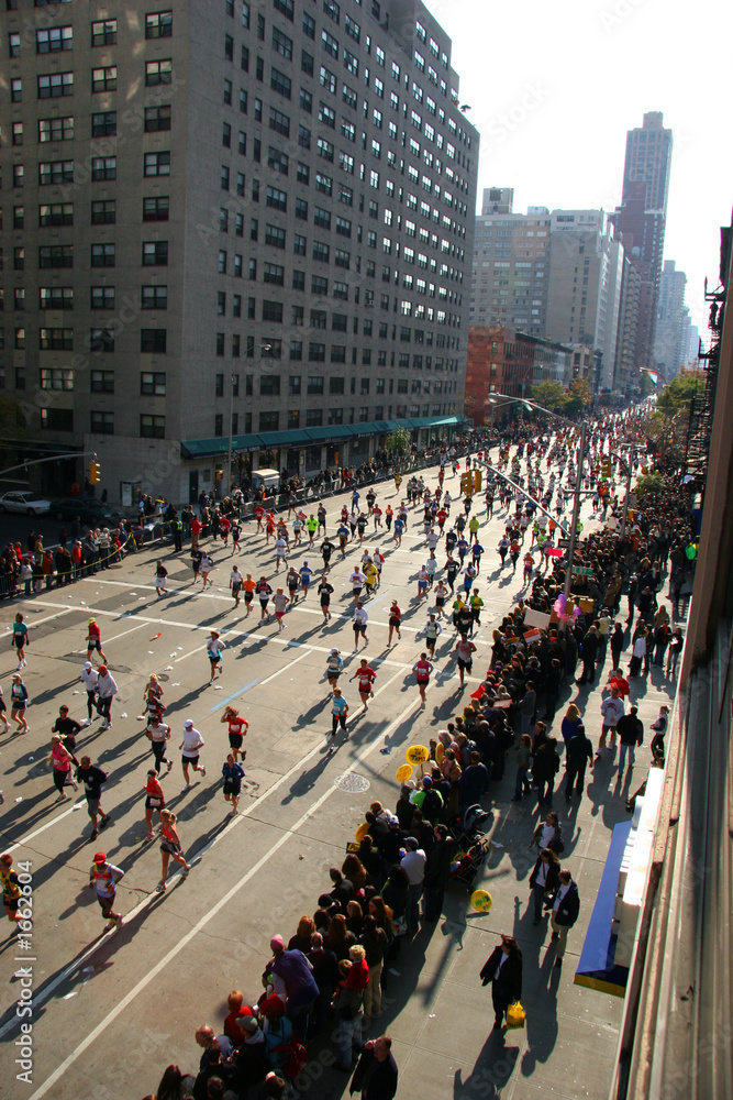 people running down the street in a marathon