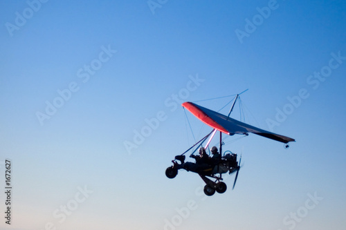 microlight aircraft in silhouette