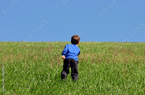 boy climbing hill