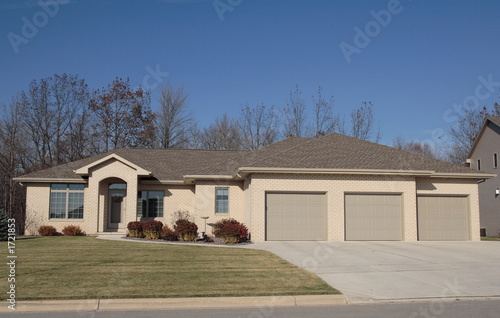masonry home with archway entrance