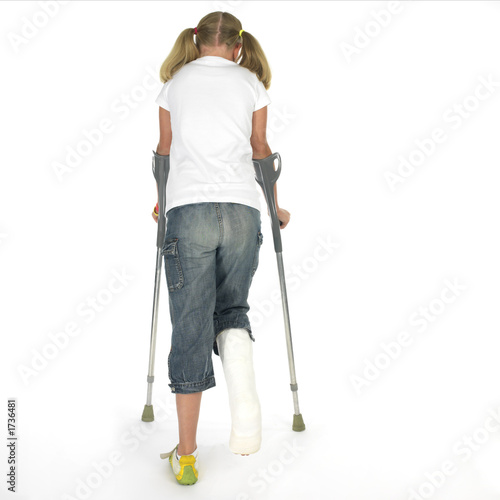 girl with a broken leg walking on crutches