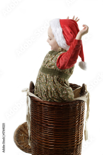 santa helper jumping out from the basket