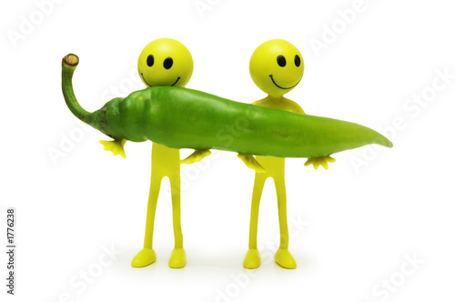 two smilies holding green pepper isolated on white photo