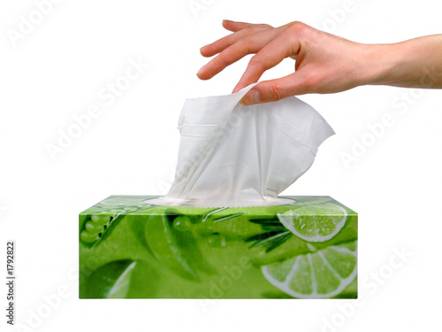 female hand taking a tissue from a box photo