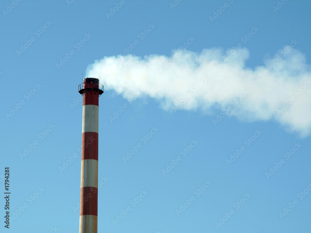 chimney in factory expelling smoke in the atmosphere