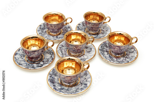six cups and saucers isolated on white