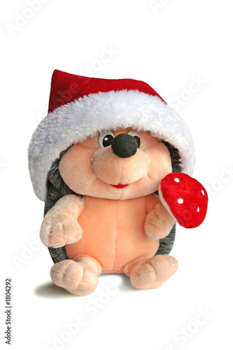 toy hedgehog decorated for christmas. fluffy toy.