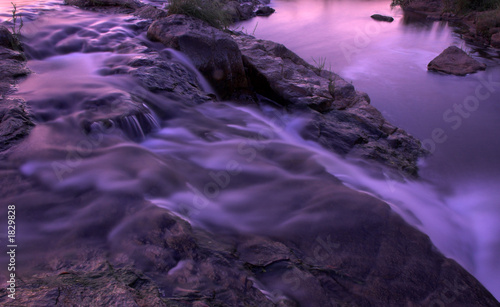 river rapids and waterfall at dusk photo