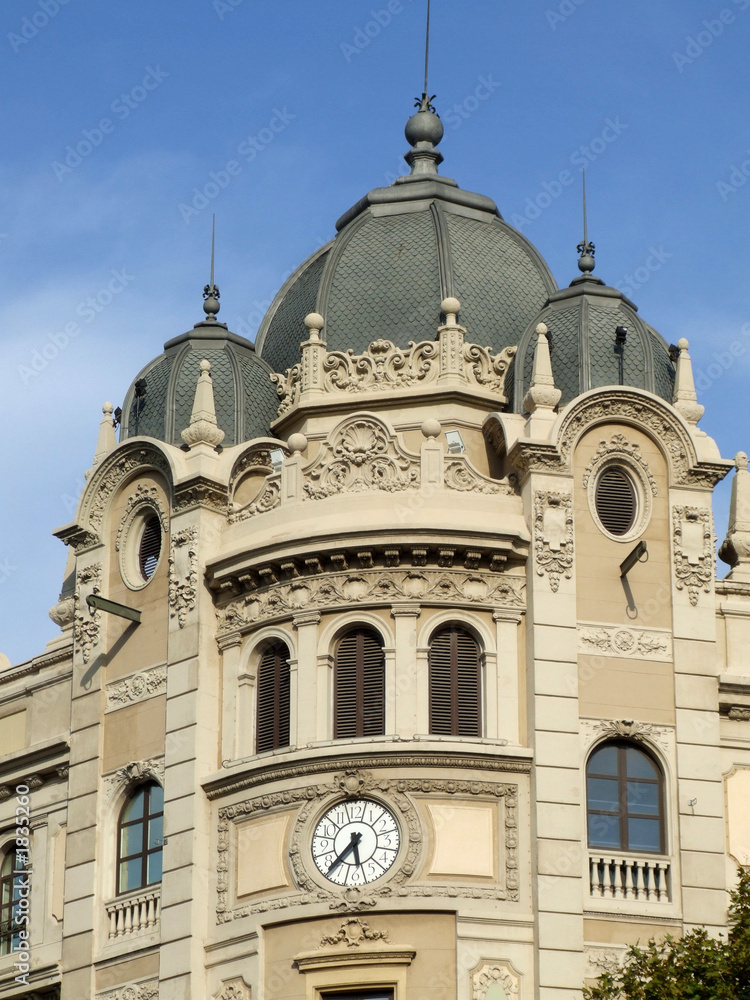 building with clock and domes