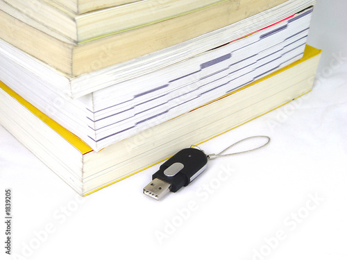 usb memory and book pile