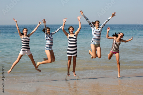 five girls jumping