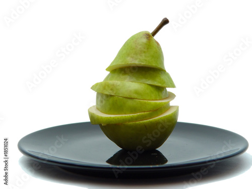 sliced pear on black plate