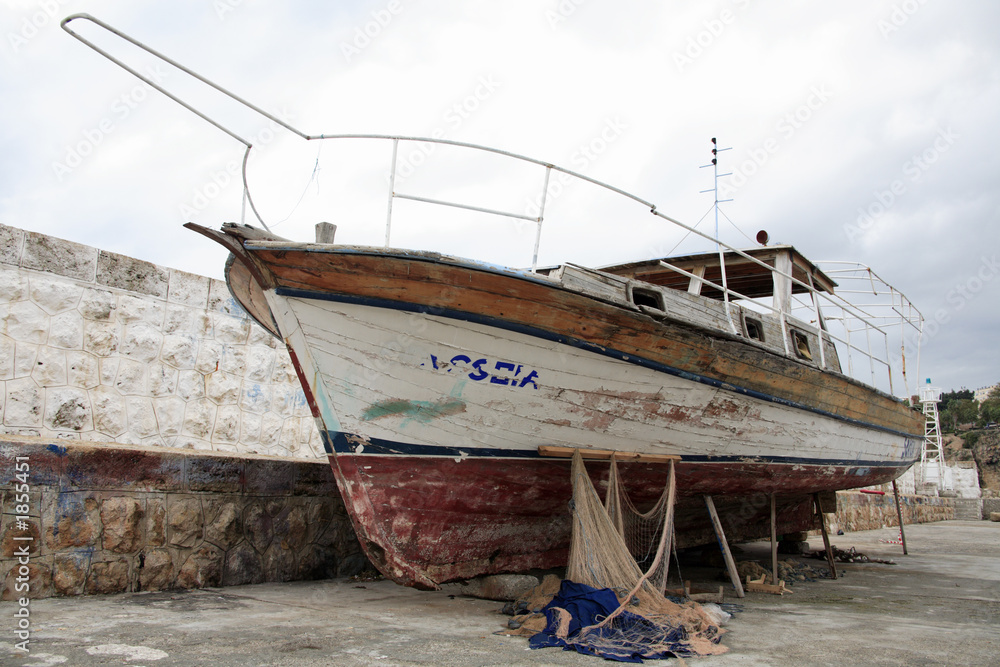 fishing boat at the quayside of the old harbour in fishing boat at the quayside of the old harbour in