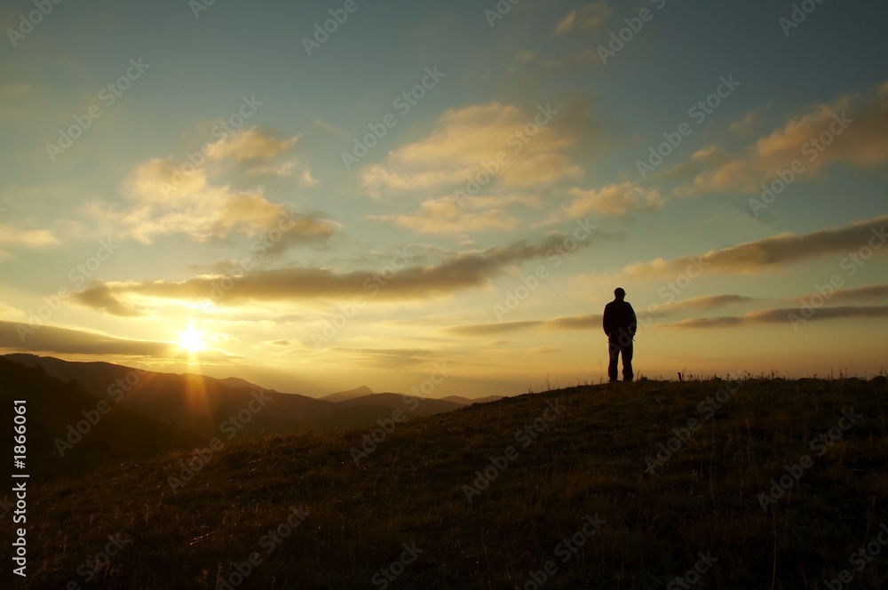 men silhouette on the sunset