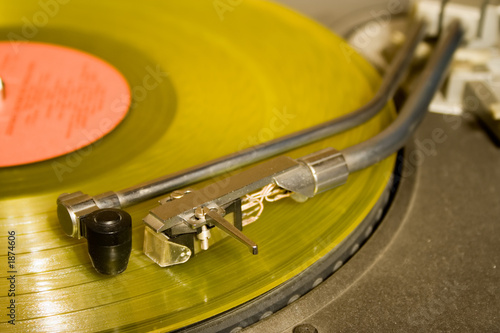 recordplayer with yellow lp records (33 1/3 rpm)