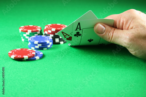 poker - a pair of aces with poker chips