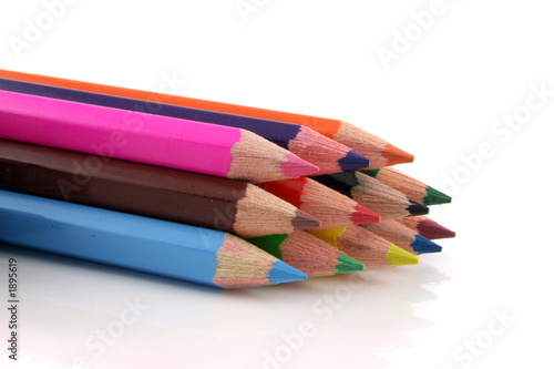 stack of colored pencils on a white background