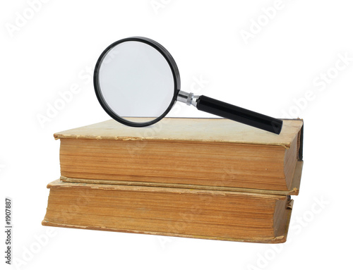 two old books and magnifying glass
