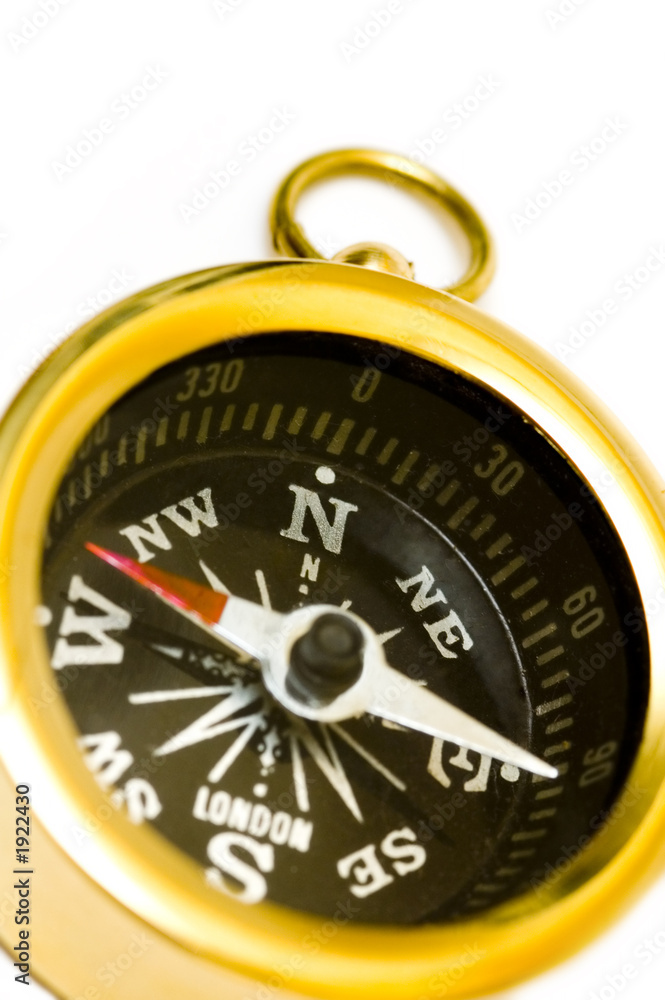 old style brass compass on white background old style brass compass on white background
