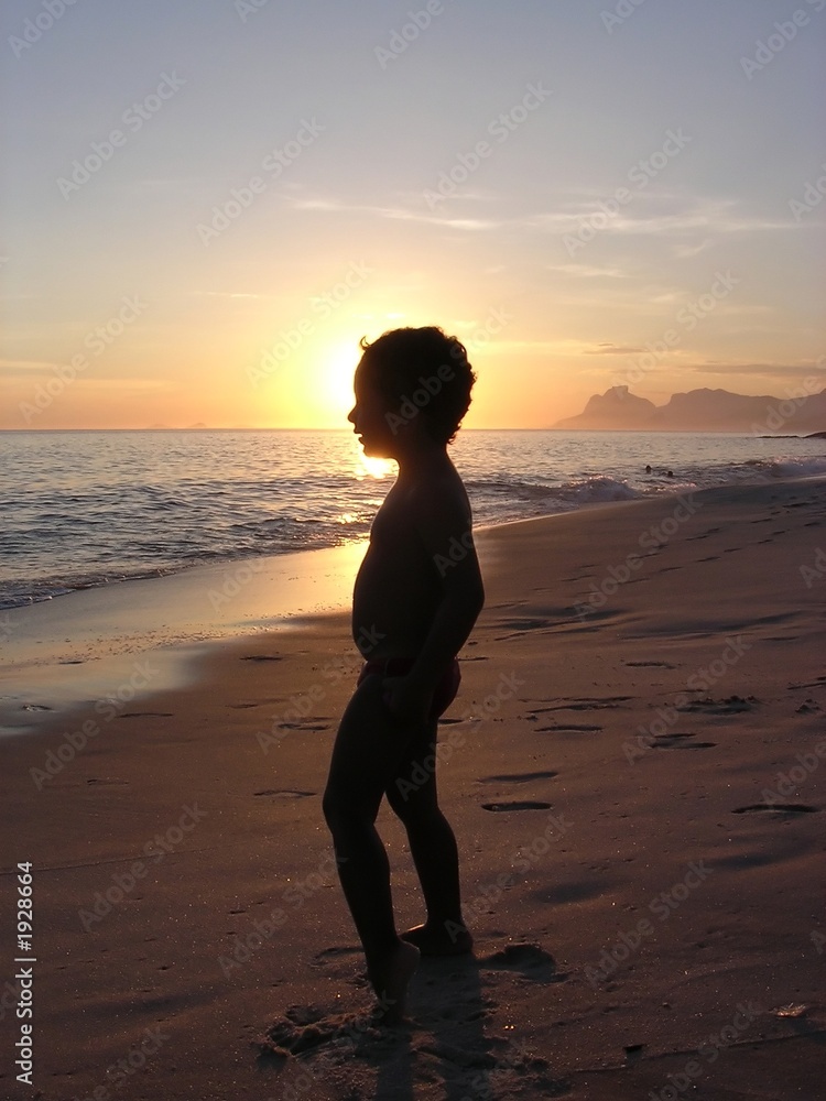 kid on the beach in silhouette