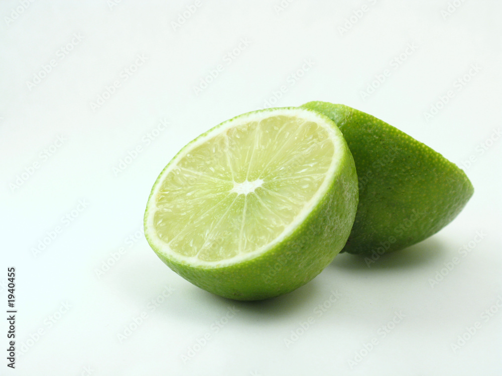 green lime on white cut in half green lime on white cut in half