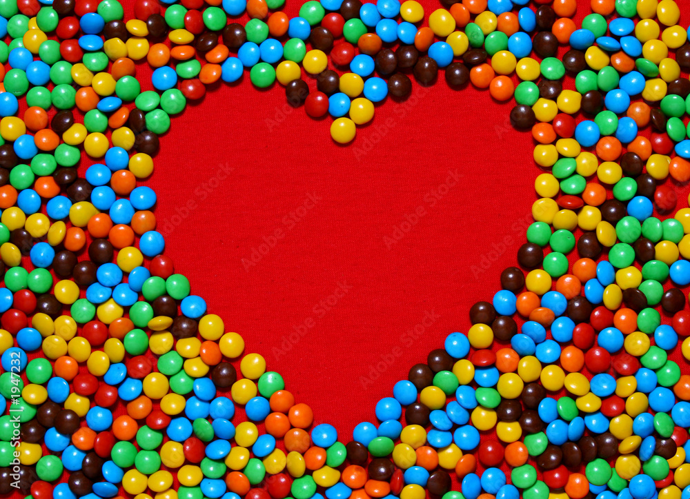 white heart shape with candy background