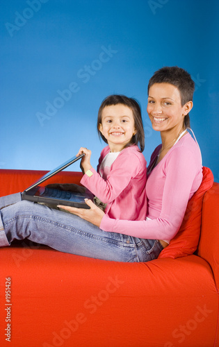 mother and douther with laptop photo