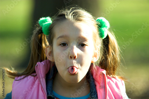 a little child sticking out tongue