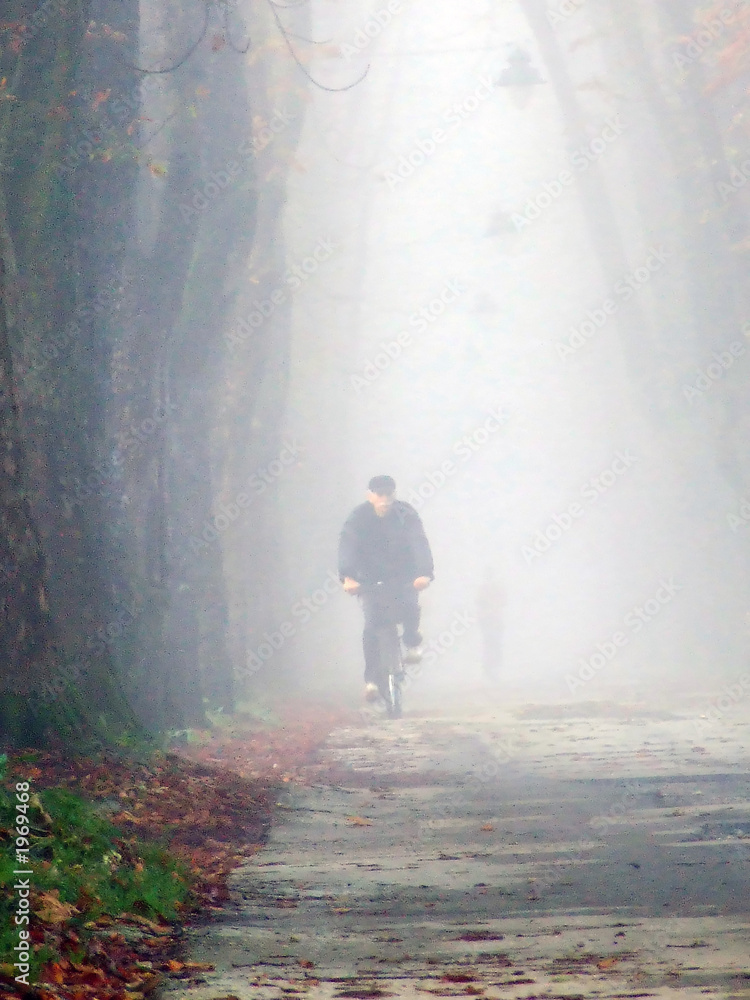 old man cycling at alley