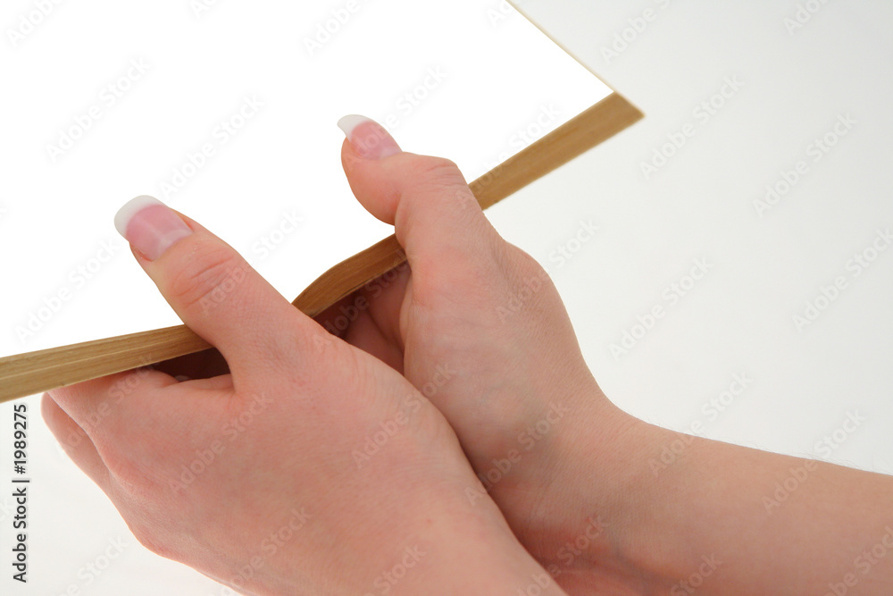 hands holding hollow book hands holding hollow book