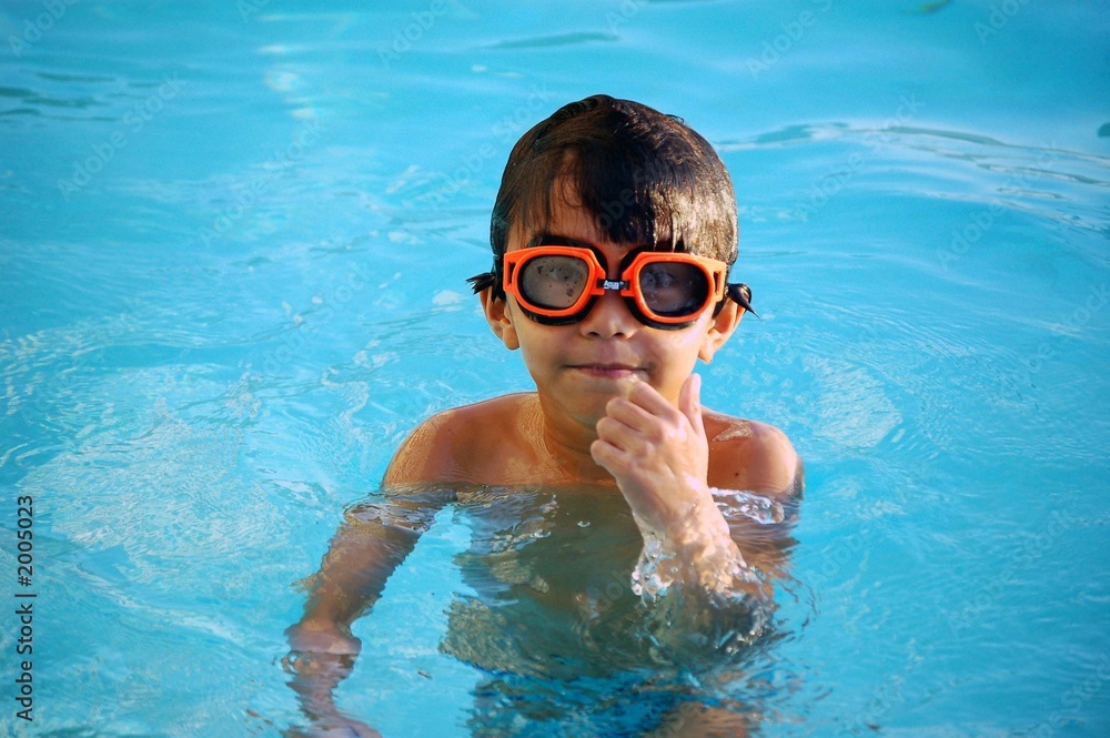 little boy in a swimming pool