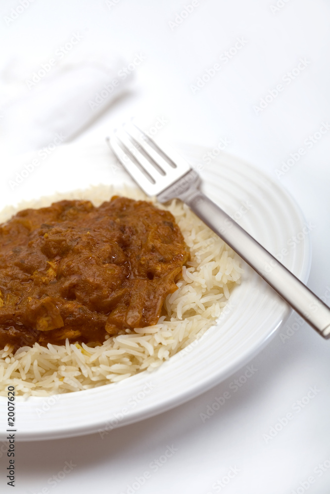 chicken curry with fork and serviette chicken curry with fork and serviette
